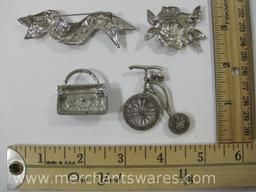 Four Silver Tone Glittery Pins, including Pocketbook and Bicycle