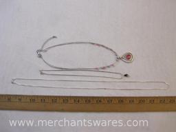 Three Silver Tone Necklaces One with Pink Accents, Long Silver Necklace is marked Italy, but not
