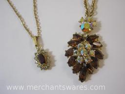 Two Gold Tone Necklaces with Pendants