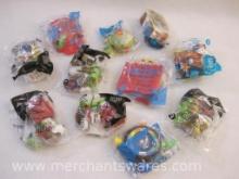Assorted McDonald's Happy Meal Toys including Connect 4, Snoopy, National Geographic Animals and