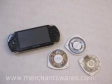 PlayStation PSP Game System and 3 Game Discs including Ultimate Ninja Heroes 2, Coded Arms, and