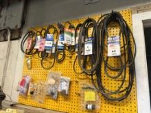 PEGBOARD WITH CONTENTS, V-BELTS, ETC., MOUNTED TO WALL,