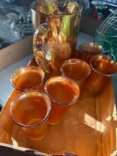 Amber depression pitcher with six matching glasses. Shipping...
