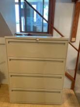 Four drawer, heavy duty, beige filing cabinet with adjustable size folder compartments. Nice