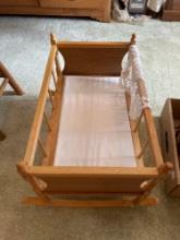 Wooden baby bassinette.