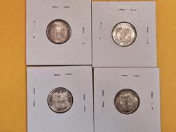 Four silver coins from Colombia