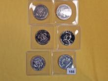 Six Proof clad and Silver Half Dollars