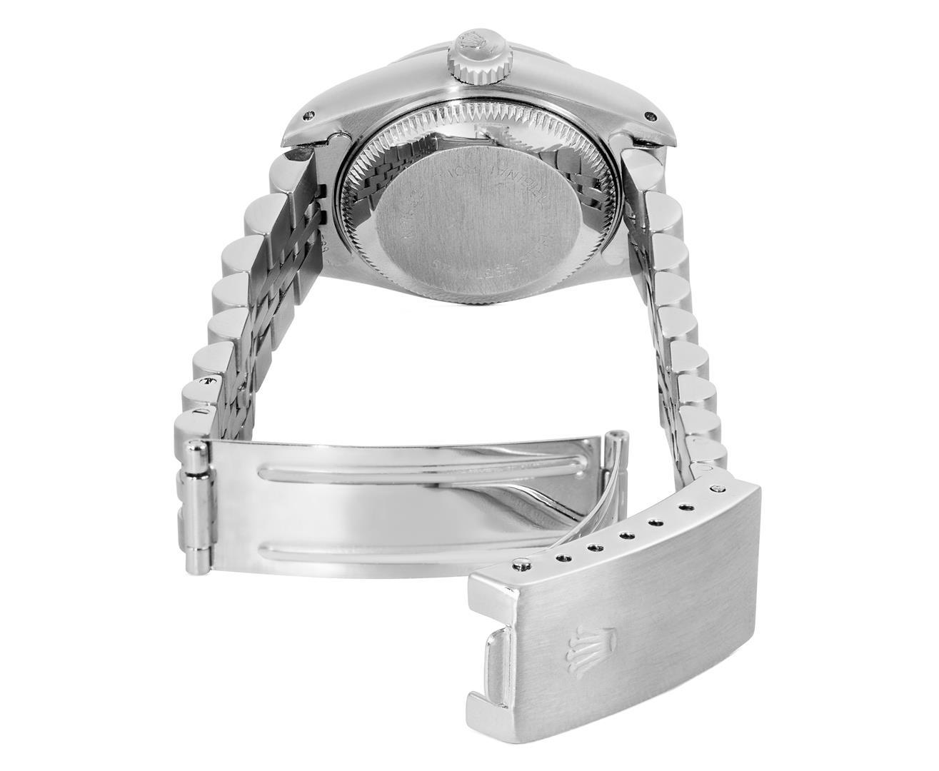 Rolex Ladies Quickset Stainless Steel Silver Index Engine Turn Bezel Date Watch