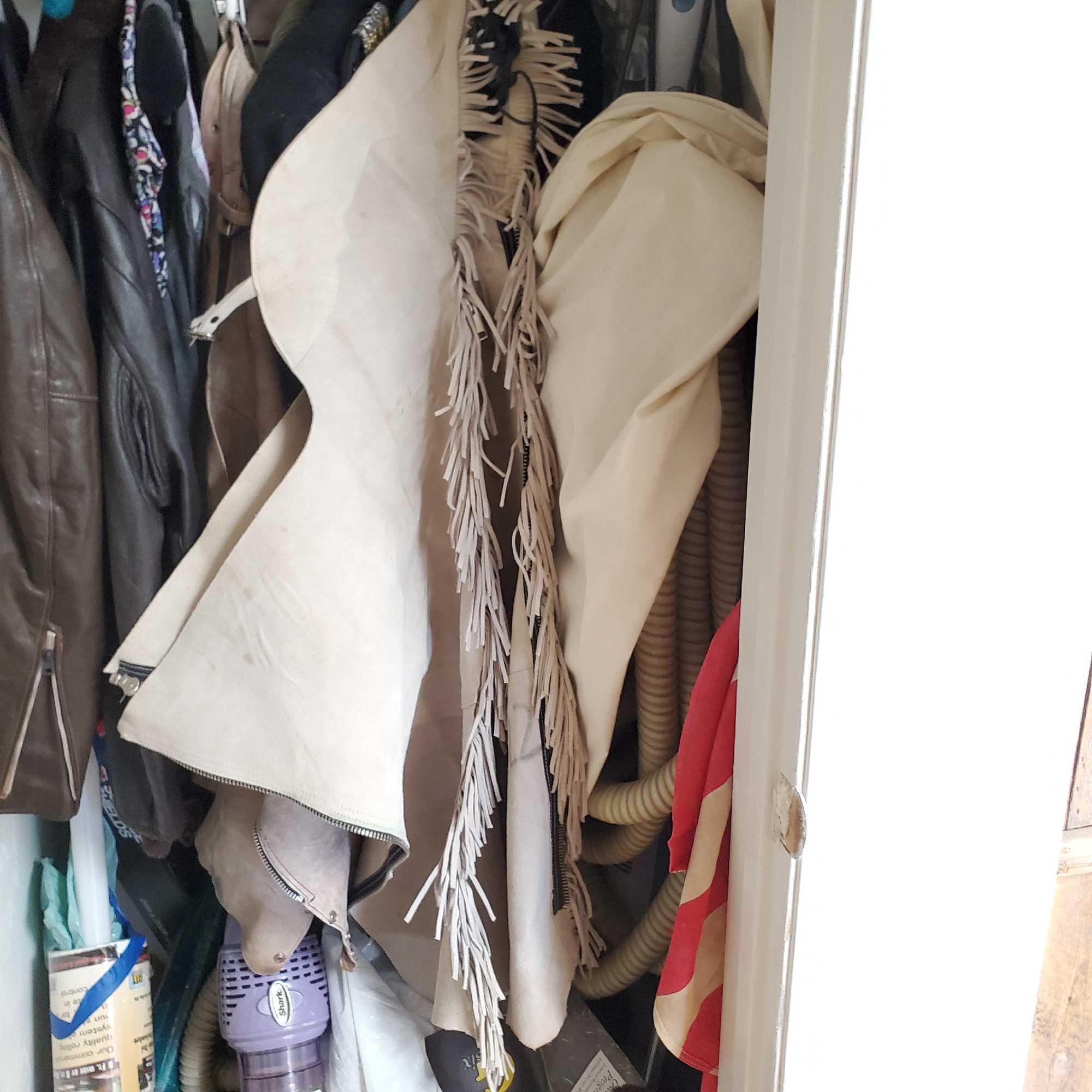 Hallway closet contents chaps leather jackets @ farm