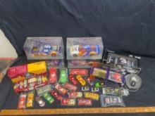 Assorted NASCAR diecast cars and watch