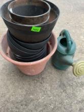 Watering Can and several Plant Pots.