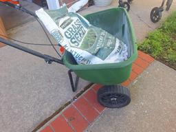 seed spreader and bag of seed