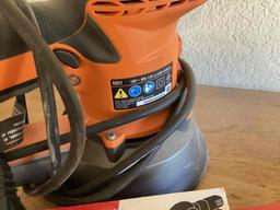 Ridgid corded sander and packages of discs