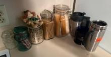 Drinking cups, vintage jars with corn, peas, candy cane, spegetti