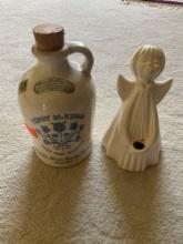 Henry McKenna Kentucky straight bourbon whiskey jug with cork. And angle candle holder sculpture and