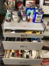 Rolling cabinet with paint supplies