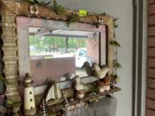 mirror as decorated with little ducks and has dress up jewelry hanging from it