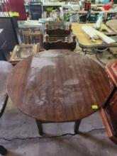 tall wooden kitchen table with fold down sides