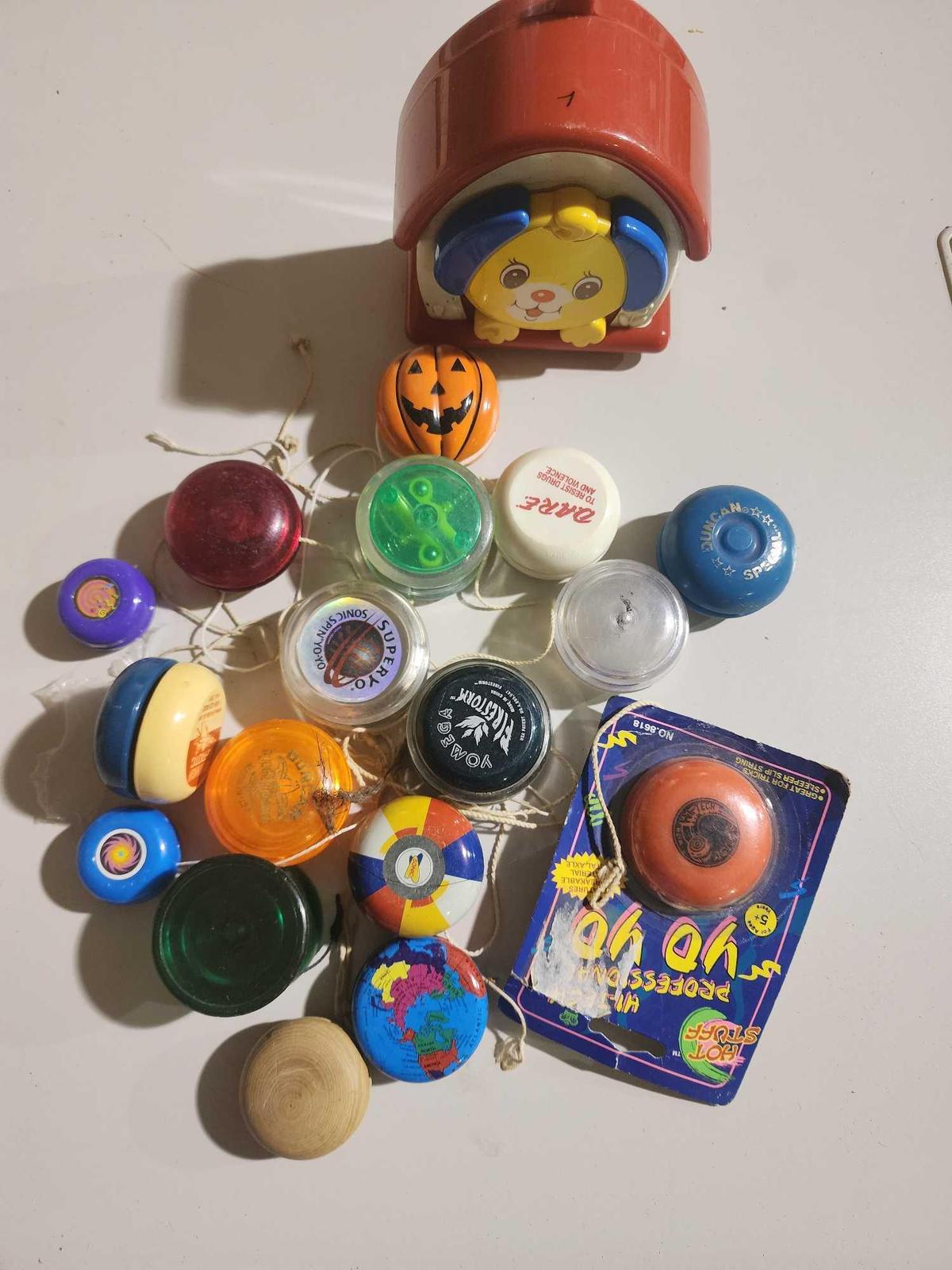 One wind-up toy and a box of old YoYo's. Used.