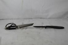 Two fixed blade knives. One Gerber bird and trout used and one Fury small belt katana, new.