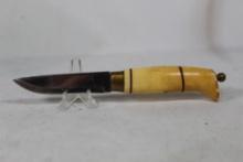 Sheath knife from Sweden or Finland. 3.25 inch blade with synthetic handle. Leather sheath has