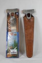 Two Pioneer Knapp sport saw with leather sheath, One in package.
