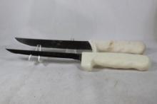 Two Dexter Russel fillet knives in plastic holders