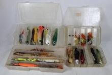 Four plastic compartment boxes with fishing lures and spinners. Used.