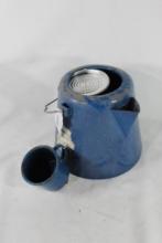 Blue enamel coffee pot with one blue enamel coffee cup