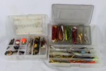 Three compartment plastic storage boxes with fishing items.