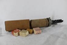 One hand held blank fired dog training launcher with two dummies and firing blanks. Used.
