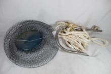 Very large fishing hook on rope and one metal fishing basket.