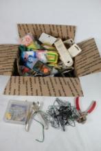 Box of miscellaneous fishing lures, and items.