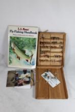 One wood fly display box, broken with flies and one fly fishing book.