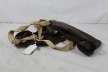 One brown leather shoulder holster. Used.