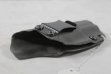 One gray hard plastic right handed belt clip holster. Used.