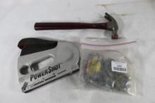 One PowerShot stapler with staples and one 12 Oz claw hammer. Used.