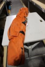 Long 5 ft orange nylon fly rod bag with two fly rods and three fly reels. Used. Will not ship,