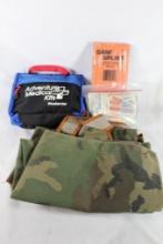 One pair of camo snake chaps and a bag of first-aid items.