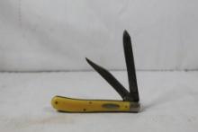 Case Trapper. Synthetic yellow scales. 3.25 inch blade. Main blade has .5 inch broken off. Made