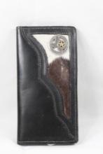Black leather and cowhide wallet. Used.