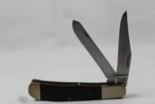 Parker-Edwards trapper with 3.0 inch main blade. Wood scales. Brass handle. Good condition in