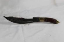 Large sheath knife made by White Tail Cutlery with 8.75 inch blade. Leather sheath with fringe.