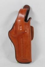 Bianchi lt brown leather belt snap holster for 4" revolver. Used in very good condition.