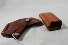 One leather Bucheimer belt holster and one leather magazine holder. Used.