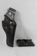 One black leather web belt right handed holster and double magazine holder. Used.