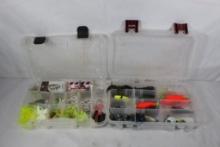 Two clear plastic boxes with miscellaneous fishing lures.