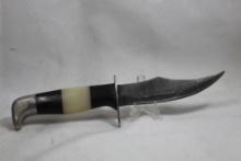 Sheath knife with 4.5 inch blade and no markings. Synthetic black and white handle. Nice leather
