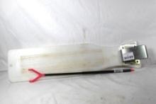 Plastic fish cleaning board with tail gripper and a fishing stick. Used.