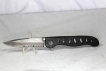 Gerber liner lock partially serrated knife with belt clip and stud